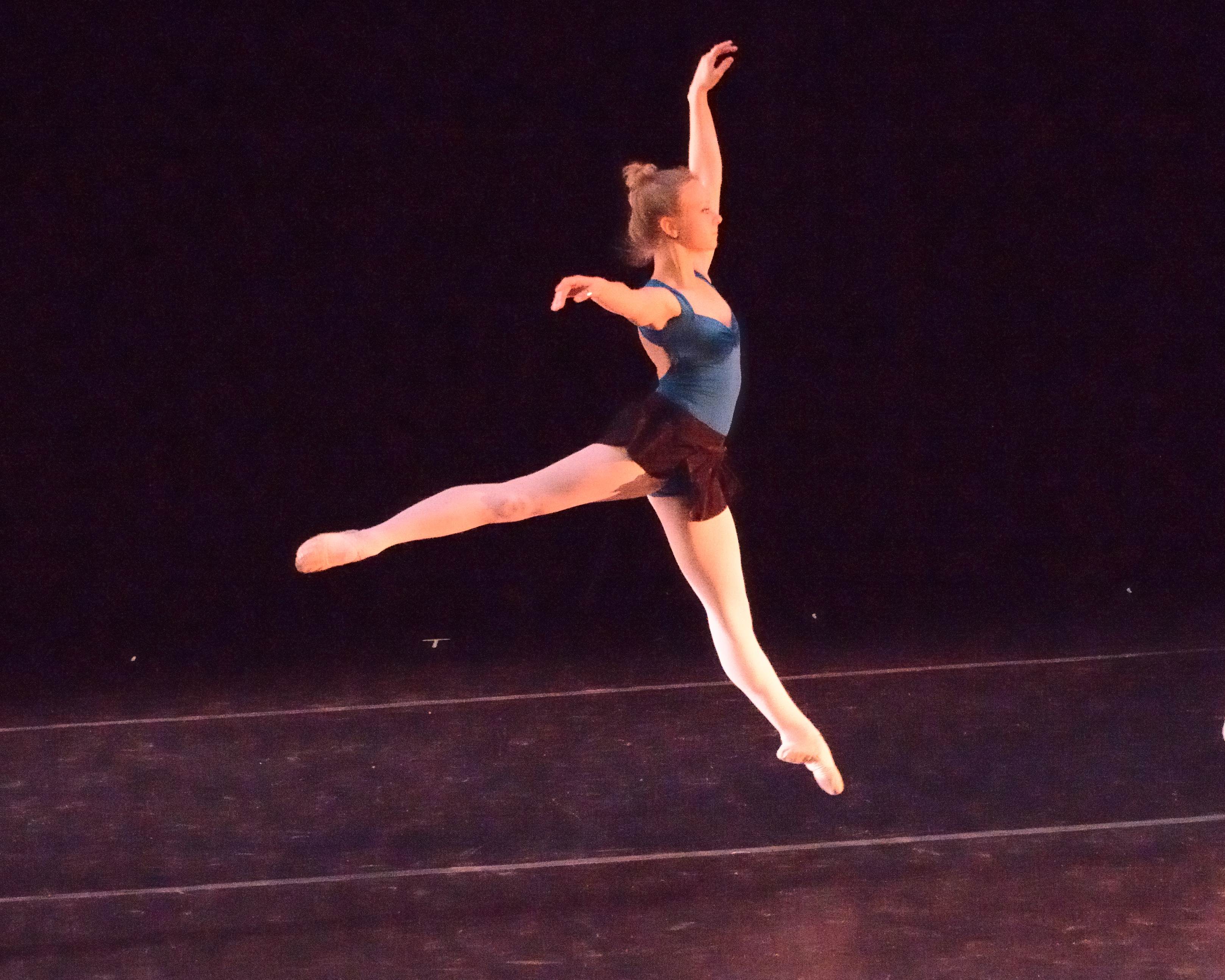 Ballet dancer saute arabesque